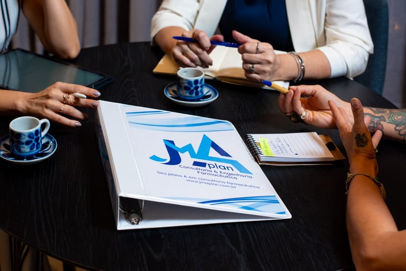 JMA Plan corporate folder in a client meeting